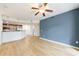 Bright and open living room with hardwood floors, great natural light, and a view to the kitchen with modern appliances at 390 17Th Nw St # 2053, Atlanta, GA 30363