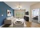 Cozy living room with neutral tones, balcony access, and a view into the primary bedroom at 390 17Th Nw St # 2053, Atlanta, GA 30363