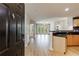 Open-concept entryway that reveals a kitchen with granite countertop and a view of the bright living room with a private balcony at 390 17Th Nw St # 2053, Atlanta, GA 30363