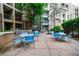 A spacious patio with tables, chairs, and a grill, perfect for outdoor entertaining at 390 17Th Nw St # 2053, Atlanta, GA 30363