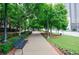Picturesque walking path lined with lush trees and greenery, perfect for leisurely strolls at 390 17Th Nw St # 2053, Atlanta, GA 30363