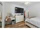 Bright bedroom featuring a vanity, large window, and neutral decor at 40 Costleys Bridge Dr, Oxford, GA 30054