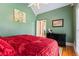 Comfortable bedroom with hardwood floors, a large window, and tranquil green walls, perfect for relaxation at 40 Costleys Bridge Dr, Oxford, GA 30054