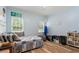 Light blue bedroom with two windows and decor accents at 40 Costleys Bridge Dr, Oxford, GA 30054