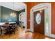 Elegant entryway featuring hardwood floors, decorative front door, and views into the dining and office areas at 40 Costleys Bridge Dr, Oxford, GA 30054