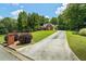 Charming brick home with long driveway and well-maintained landscaping on a sunny day at 40 Costleys Bridge Dr, Oxford, GA 30054