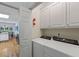 Functional laundry area with modern washer and dryer units, conveniently located near the kitchen at 40 Costleys Bridge Dr, Oxford, GA 30054