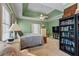 This bedroom has a bookshelf, a dresser, and a small sitting area for relaxing or reading at 40 Costleys Bridge Dr, Oxford, GA 30054