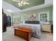 Spacious main bedroom offering a peaceful retreat with large windows and ample space for furniture at 40 Costleys Bridge Dr, Oxford, GA 30054