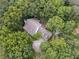 Aerial view of a single-Gathering home nestled among lush, green trees, offering a serene, private setting at 34 Johnston Nw Row, Cartersville, GA 30121