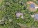 Aerial view of the home in wooded, private setting, neighboring houses visible in distance at 34 Johnston Nw Row, Cartersville, GA 30121