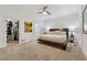 Large bedroom with ceiling fan, closet access, and neutral carpet and paint at 34 Johnston Nw Row, Cartersville, GA 30121