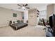 Stylish bedroom featuring a unique platform bed, ceiling fan, and comfortable chair at 34 Johnston Nw Row, Cartersville, GA 30121