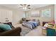 Cozy bedroom featuring a ceiling fan, plush rug, and soft natural lighting at 34 Johnston Nw Row, Cartersville, GA 30121