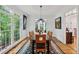 Elegant dining room featuring hardwood floors, large windows, and stylish lighting at 34 Johnston Nw Row, Cartersville, GA 30121
