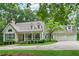 Charming home with a manicured lawn, inviting front porch and an attached three car garage at 34 Johnston Nw Row, Cartersville, GA 30121