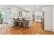 Bright kitchen features white cabinets, granite countertops, a center island with seating, and hardwood floors at 34 Johnston Nw Row, Cartersville, GA 30121