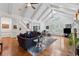 Bright living room with a fireplace, hardwood floors, coffered ceilings, and large windows at 34 Johnston Nw Row, Cartersville, GA 30121
