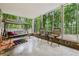 Inviting screened porch with outdoor seating, providing a relaxing space overlooking the wooded area at 34 Johnston Nw Row, Cartersville, GA 30121