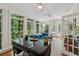 Bright sunroom featuring lots of natural light, paneled walls, and access to the outdoor area at 34 Johnston Nw Row, Cartersville, GA 30121