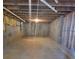 Unfinished basement with concrete floor and exposed ceiling for customizable space at 3045 Binghampton Ln, Lawrenceville, GA 30044