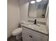 Modern bathroom features a granite countertop, white cabinetry, and sleek black fixtures at 3045 Binghampton Ln, Lawrenceville, GA 30044