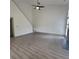 Spacious living room with high ceilings, light gray floors and modern finishes, perfect for relaxation and entertaining guests at 3045 Binghampton Ln, Lawrenceville, GA 30044