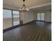 Spacious living room features wood flooring and neutral paint at 3045 Binghampton Ln, Lawrenceville, GA 30044