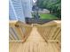 Exterior wooden stairs connect the deck to the yard, offering easy access to outdoor areas at 3045 Binghampton Ln, Lawrenceville, GA 30044