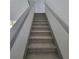 Carpeted stairway with modern gray trim and clean white walls, leads to the upper level of the home at 3045 Binghampton Ln, Lawrenceville, GA 30044