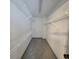 Walk-in closet featuring carpet and wire shelving for maximum storage capacity at 3045 Binghampton Ln, Lawrenceville, GA 30044