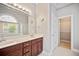 Bathroom with large vanity, walk-in closet, tub and glass shower near an arched window at 1979 Spivey Village Dr, Jonesboro, GA 30236