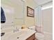 Well-lit bathroom featuring a single sink vanity and shower-tub combination at 1979 Spivey Village Dr, Jonesboro, GA 30236