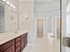 Bathroom boasts a large mirror, double sinks, bathtub, walk-in closet, and ample natural light at 1979 Spivey Village Dr, Jonesboro, GA 30236