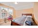 Bedroom with natural light, bed, and adjacent desk at 1979 Spivey Village Dr, Jonesboro, GA 30236