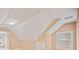 Neutral bedroom with vaulted ceilings and natural light from two windows at 1979 Spivey Village Dr, Jonesboro, GA 30236
