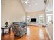 Bright living room with vaulted ceiling and fireplace, features hardwood floors and many windows at 1979 Spivey Village Dr, Jonesboro, GA 30236