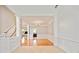 Bright living room featuring wood floors, a chandelier, and staircase with white railings and spindles at 1979 Spivey Village Dr, Jonesboro, GA 30236