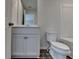 Bathroom view with a vanity, sleek fixtures, and a toilet at 3968 Annsbury Court, Lilburn, GA 30047