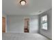 Bright bedroom with carpet floors and natural light from a window and entryways at 3968 Annsbury Court, Lilburn, GA 30047