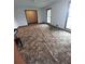 Open-concept living room with hardwood floors and large windows at 6005 Hendrix Rd, Cumming, GA 30040
