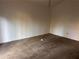 Bedroom featuring neutral carpet and white walls at 7472 Woods Ct, Lithonia, GA 30058