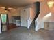 Open-concept with hardwood and carpet flooring, and a staircase at 7472 Woods Ct, Lithonia, GA 30058