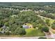 Aerial view highlighting the property with a private pool and lush surroundings at 858 Pates Creek Rd, Stockbridge, GA 30281