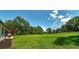 Expansive backyard featuring green lawn and natural wooded backdrop at 858 Pates Creek Rd, Stockbridge, GA 30281