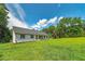 Charming ranch-style home featuring a well-manicured lawn and mature trees at 858 Pates Creek Rd, Stockbridge, GA 30281