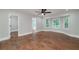 Spacious main bedroom featuring hardwood floors, a ceiling fan, and ensuite bathroom at 858 Pates Creek Rd, Stockbridge, GA 30281