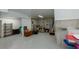 Unfinished basement has painted floors with some storage space at 1404 Fairwinds Ct, Loganville, GA 30052