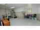 Partially finished basement with painted floors and exposed ceiling beams at 1404 Fairwinds Ct, Loganville, GA 30052