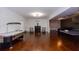 Wide open basement boasts an air hockey table, ping pong table, and media space at 1404 Fairwinds Ct, Loganville, GA 30052